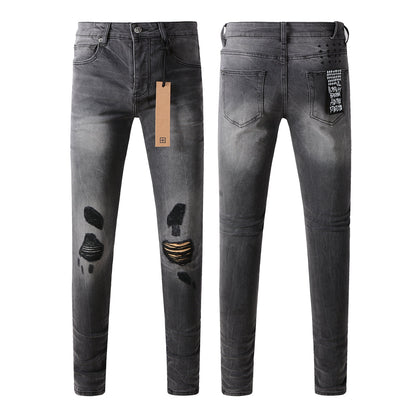 Urban Gray Ripped Jeans with Bold Black Graffiti Accents 3003