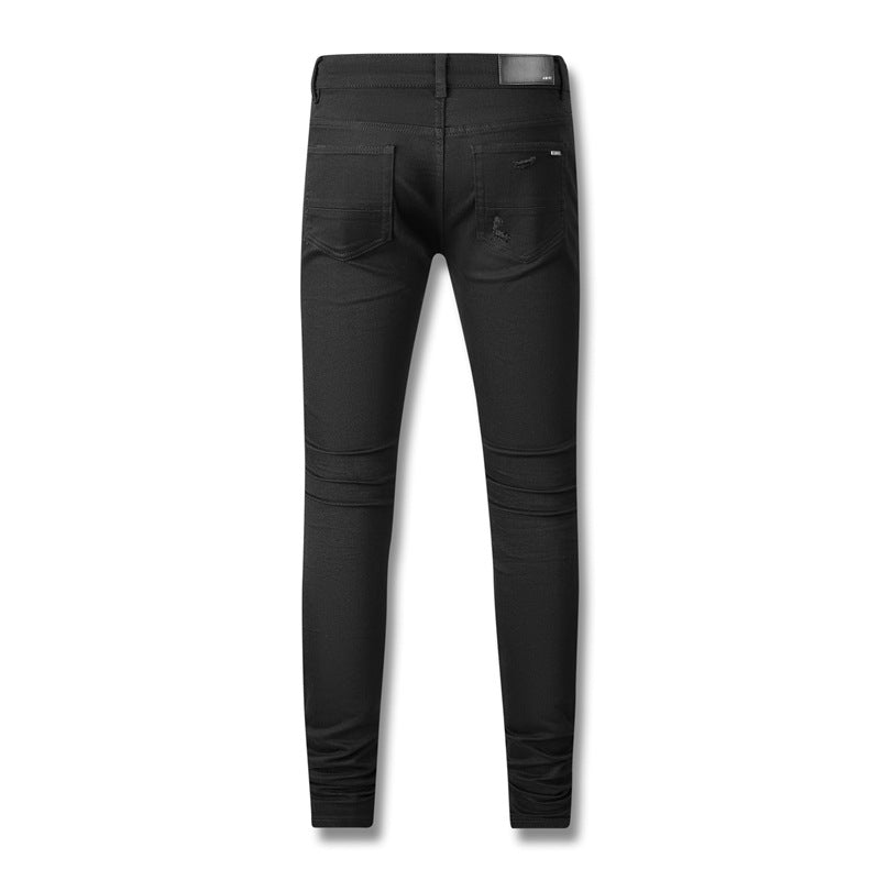 Jean noir vieilli 602 avec patchwork en similicuir pour un look avant-gardiste 