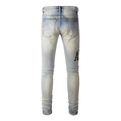 Pantalones vaqueros ajustados de estilo urbano europeo y americano con parches y letras bordadas y diseño moderno de High Street para hombre n.° 878 