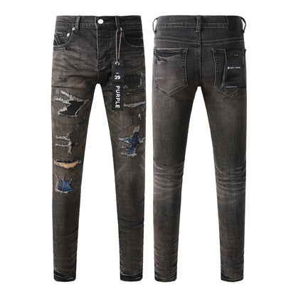 Pantalon en denim noir chic et vieilli 9080 combinant déchirures et patchs pour un style moderne 