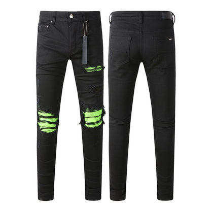 Vaqueros pitillo negros rotos 8880 con parches verdes para un look atrevido 